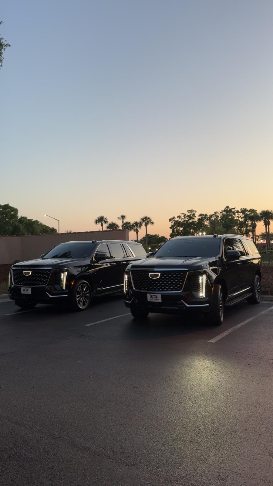 Black Cadillac Escalade SUVs at dusk for Los Angeles chauffeur service